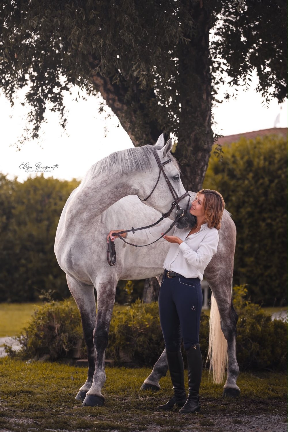 Alice Orlandi with a grey horse